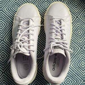 Lavender Stan Smith sneakers.